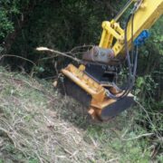 Flail mulcher clearing a bank